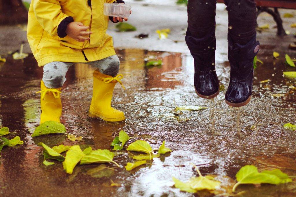 Fostering Curiosity in Children exploring puddles