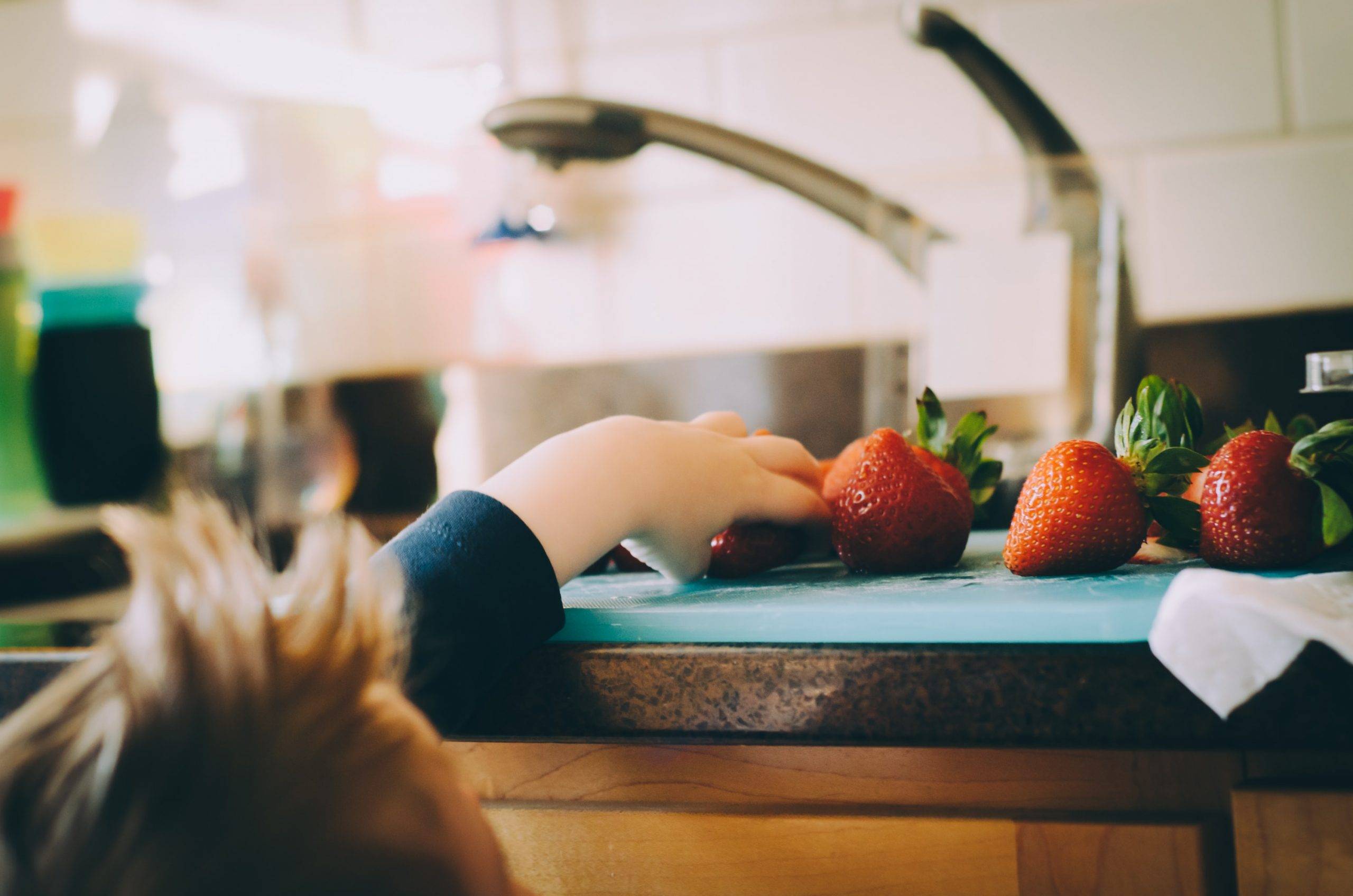 Cooking with kids in the kitchen helps them develop essential skills
