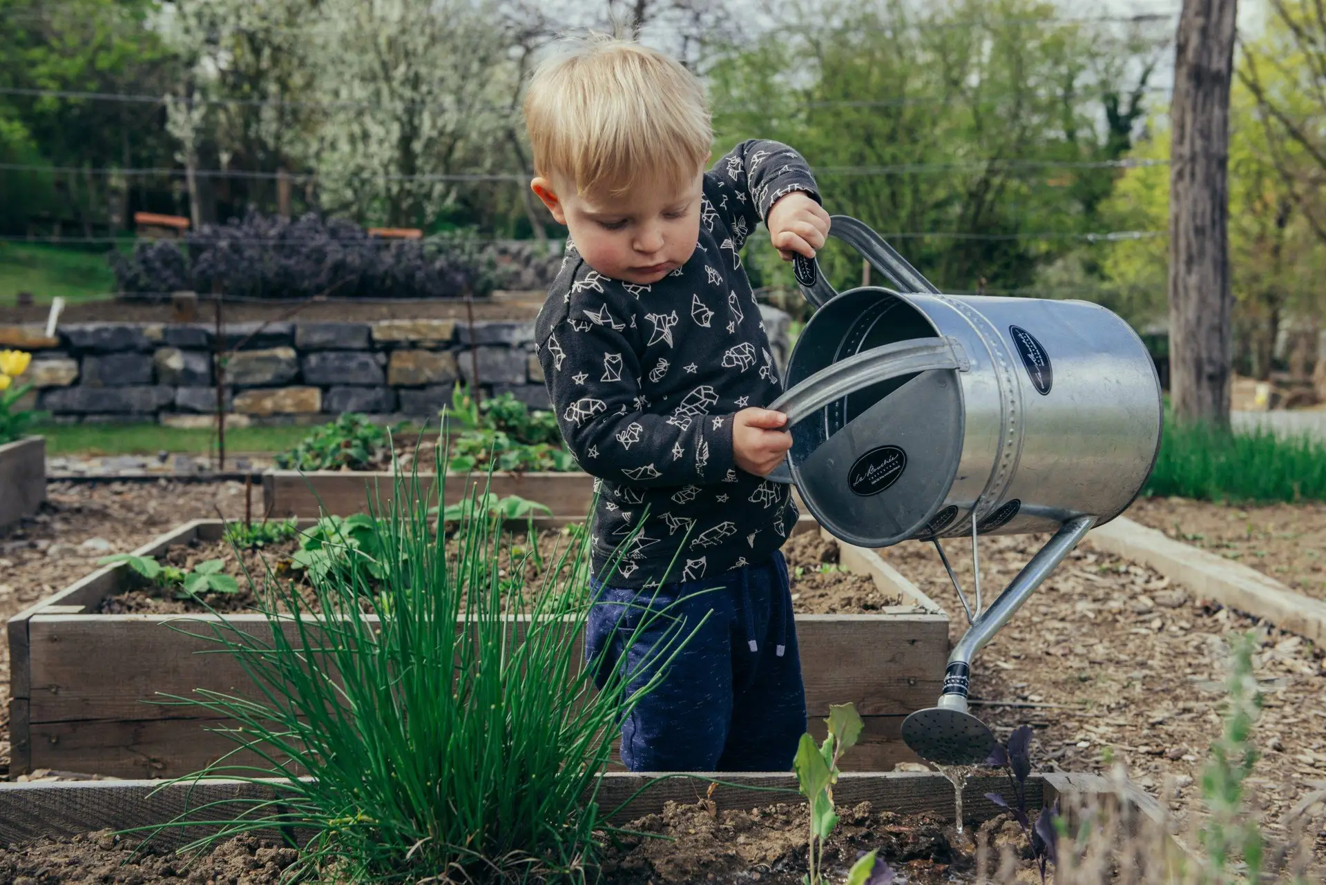 Boy doing fun outdoor activity - gardening