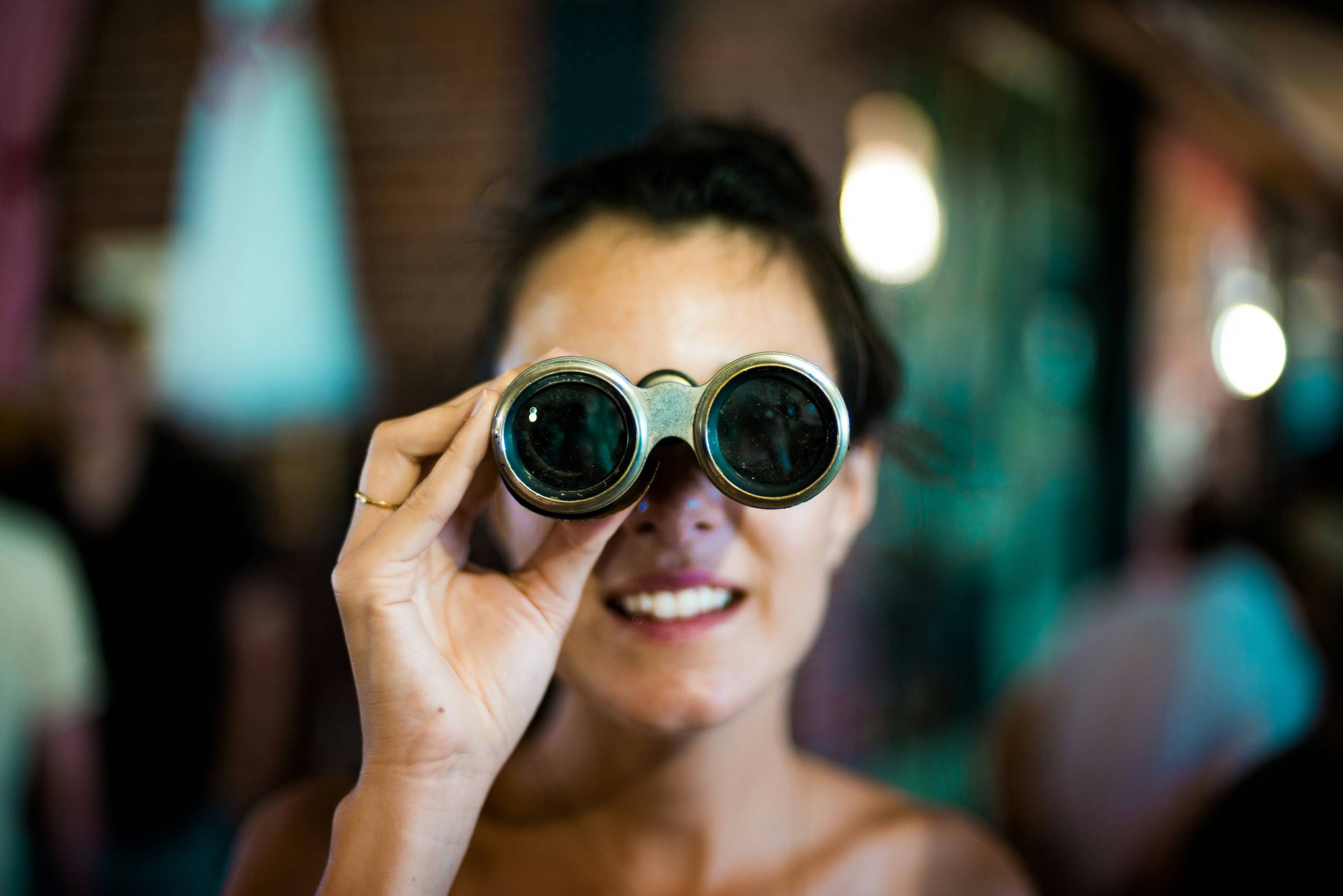 Strategies for nurturing curiosity. Adult with binoculars